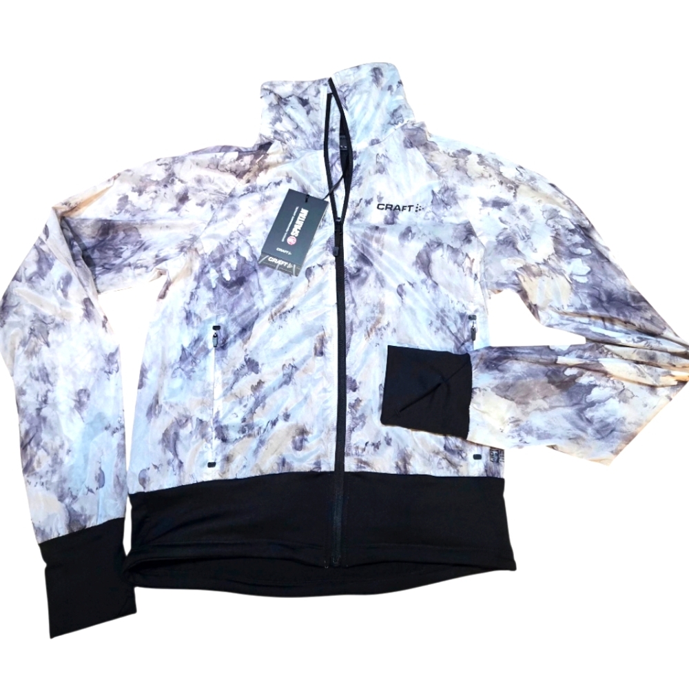 Craft Extra light glow in the dark running jacket with front pockets.  XS.